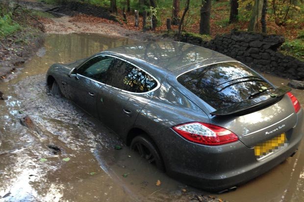 Porsche into a flooded ditch